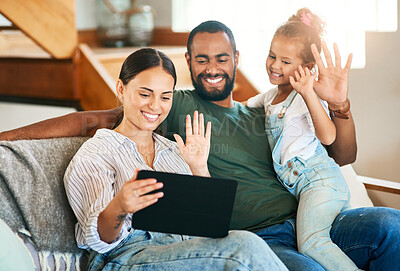 Buy stock photo Shot of a happy family making a video call on a digital tablet at home