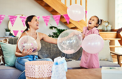 Buy stock photo Shot of a little girl celebrating a birthday with her parents at home