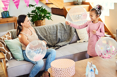 Buy stock photo Shot of a little girl celebrating a birthday with her parents at home