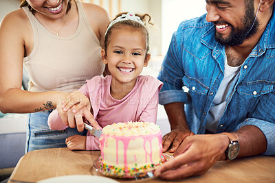 Buy stock photo Shot of a little girl celebrating a birthday with her parents at home