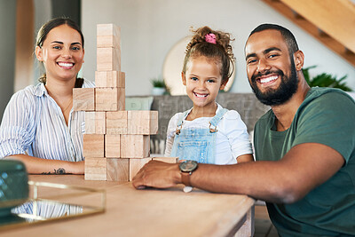 Buy stock photo Portrait of a happy family playing with wooden blocks together at home