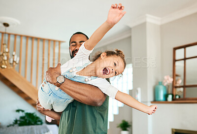 Buy stock photo Shot of a father and his little daughter having fun together at home
