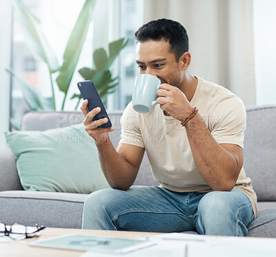Buy stock photo Man, phone and reading with coffee on sofa in home for taste of hot beverage. Asian person, texting and mobile app for message, internet and social media by cellular with drink to relax living room