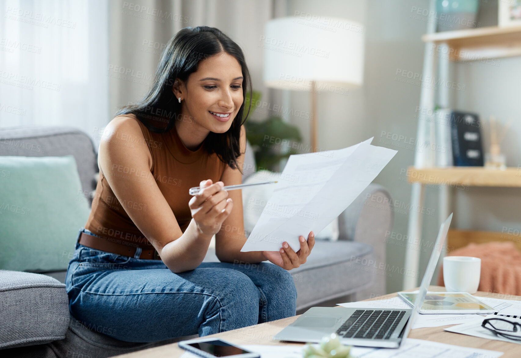 Buy stock photo Happy woman, laptop and documents on sofa for finance, expenses or paying bills in living room at home. Female person smile with paperwork for good budget, investments or financial plan at house