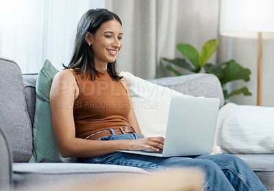 Buy stock photo Woman, remote work and smile on sofa with laptop to update blog post, social media and research information on website. Happy freelancer with computer for online shopping, elearning and typing email 