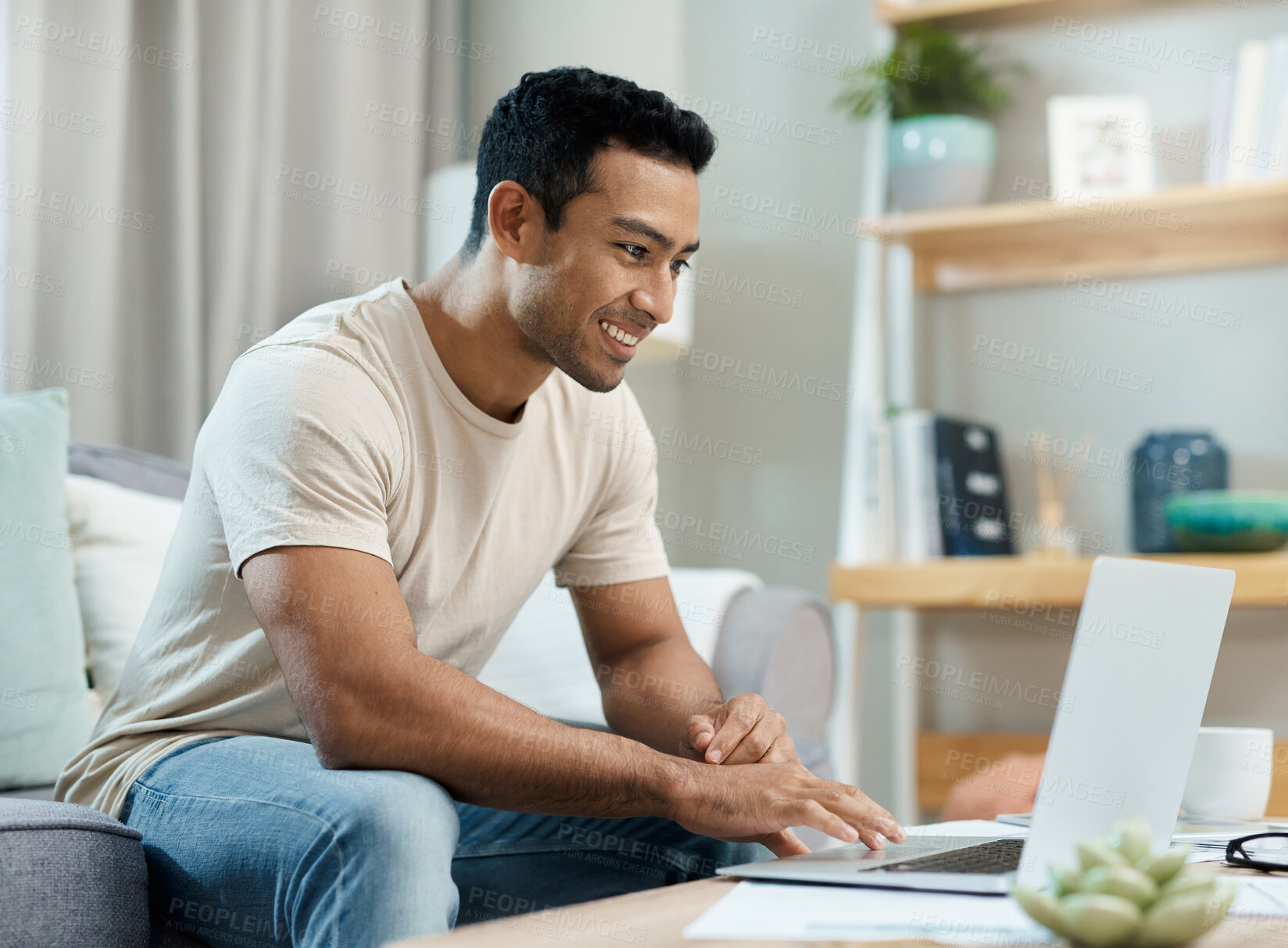 Buy stock photo Laptop, typing and man on sofa for remote work, working from home and freelance career. Happy, living room and person on computer writing email for website, online project and internet research