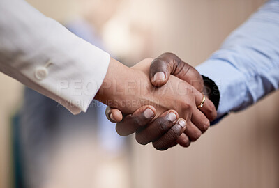 Buy stock photo Shot of two businesspeople shaking hands in greeting