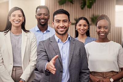 Buy stock photo Shot of a team of businessman ready to shake hands with his team