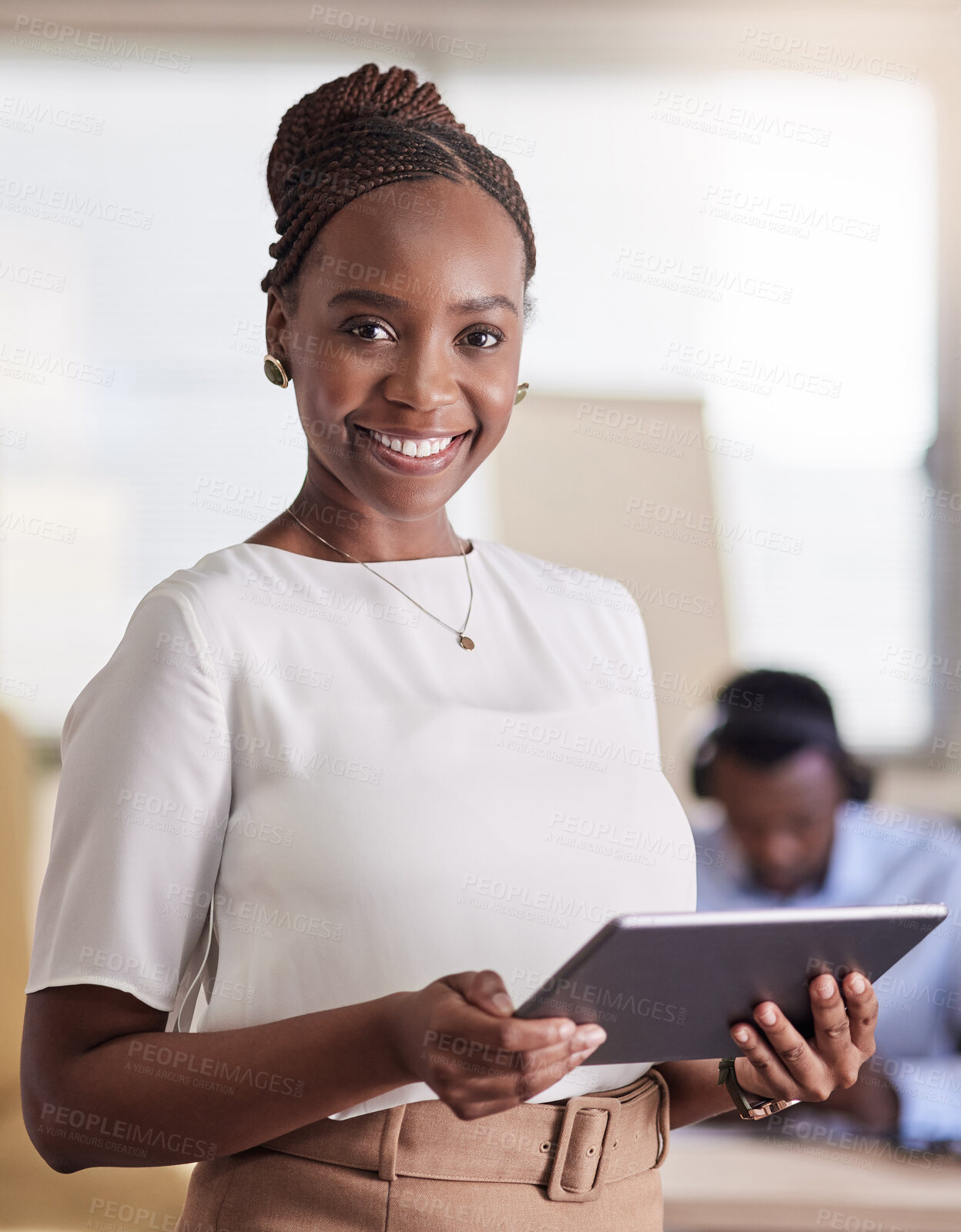 Buy stock photo Shot of a young businesswoman using her digital tablet