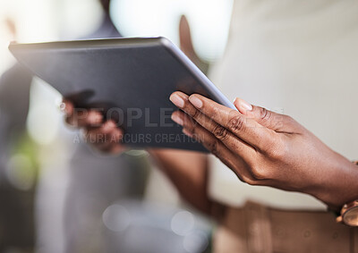 Buy stock photo Shot of a businesswoman using her digital tablet at work