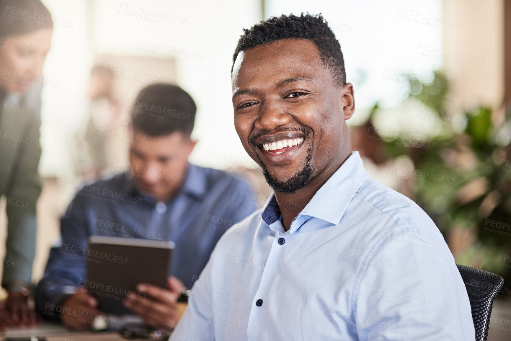 Buy stock photo Shot of a young businessman in his office