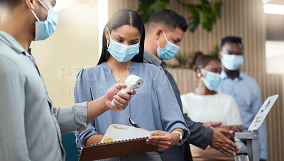 Buy stock photo Cropped shot of an attractive young businesswoman wearing a mask and going through covid screen while standing at the head of a queue in her office