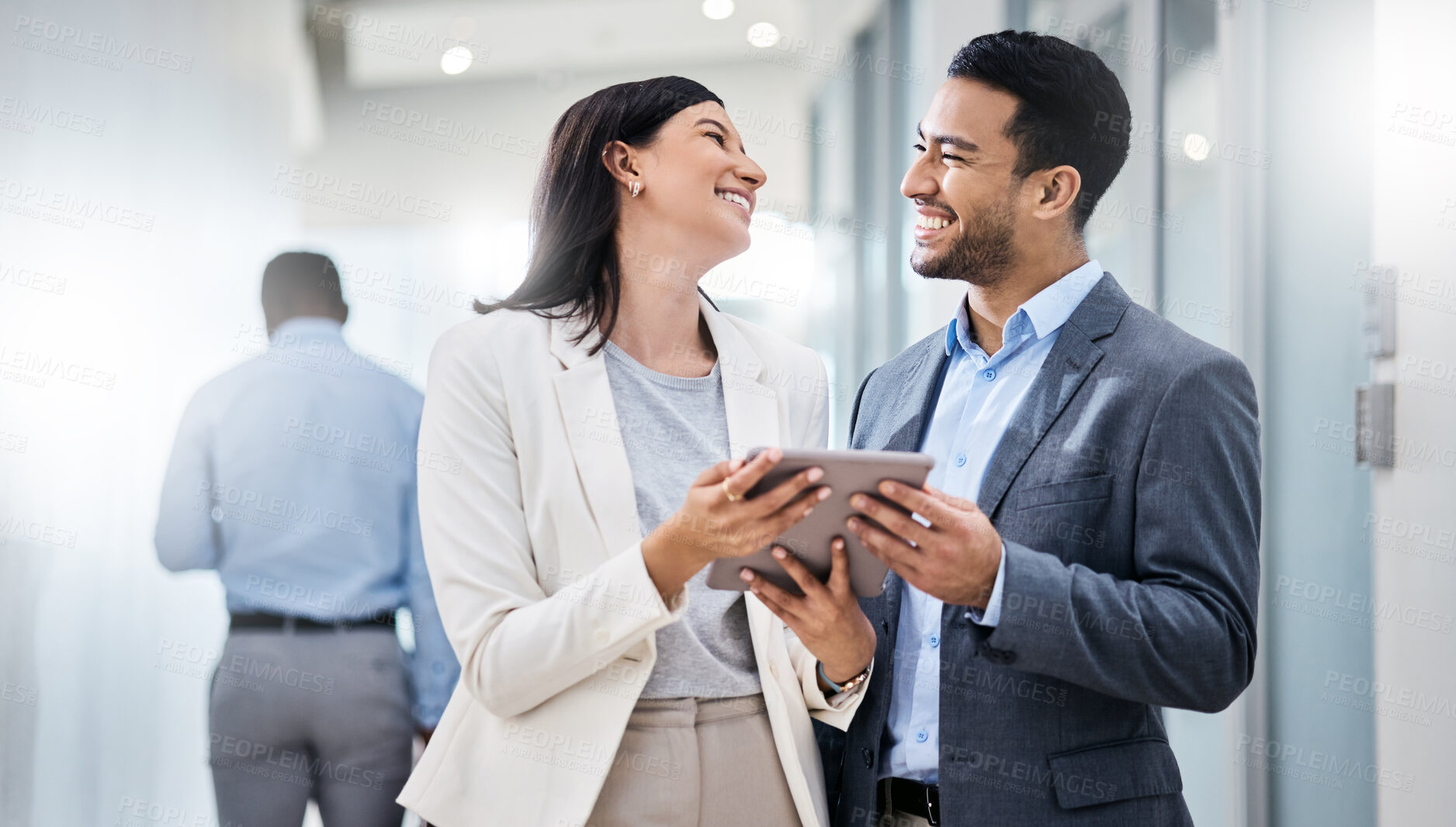 Buy stock photo Shot of two businesspeople discussing something on a digital tablet