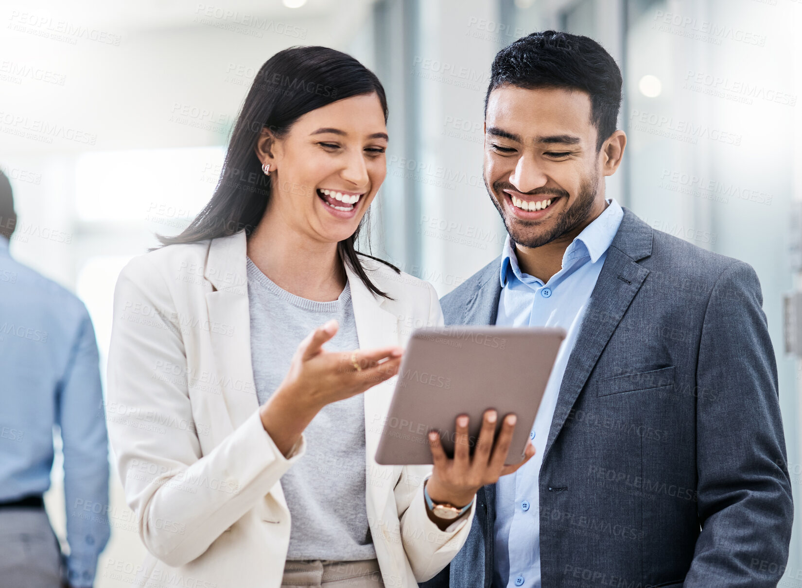 Buy stock photo Shot of two businesspeople discussing something on a digital tablet