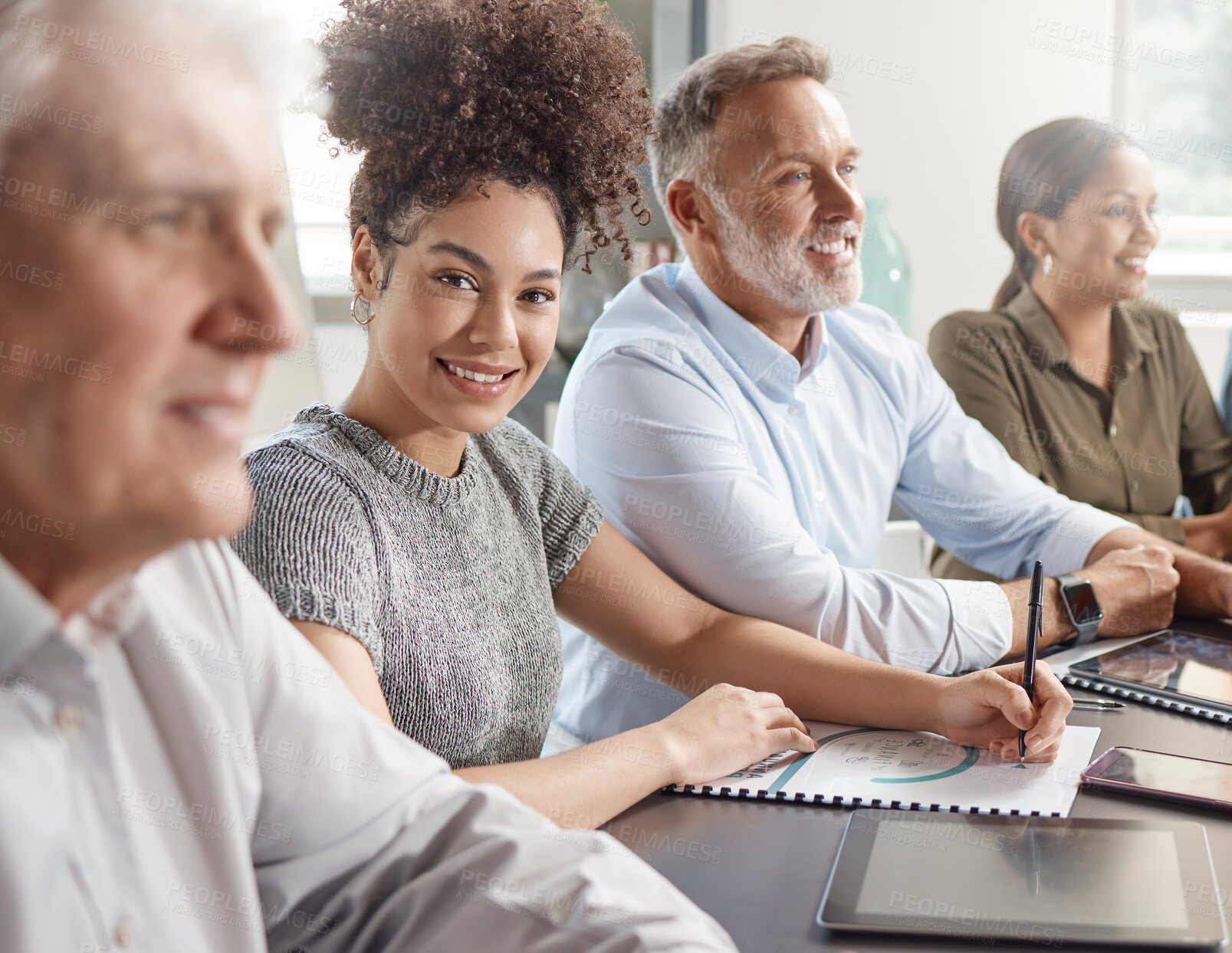 Buy stock photo Shot of a group of businesspeople in a meeting at work