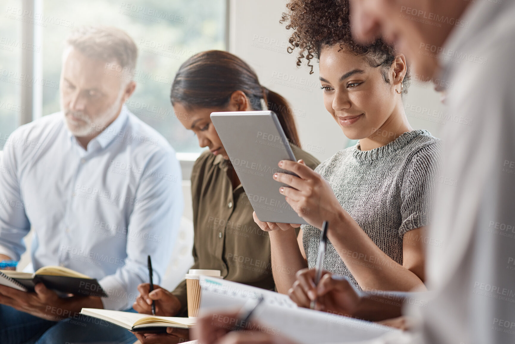 Buy stock photo Shot of a group of businesspeople in a meeting at work