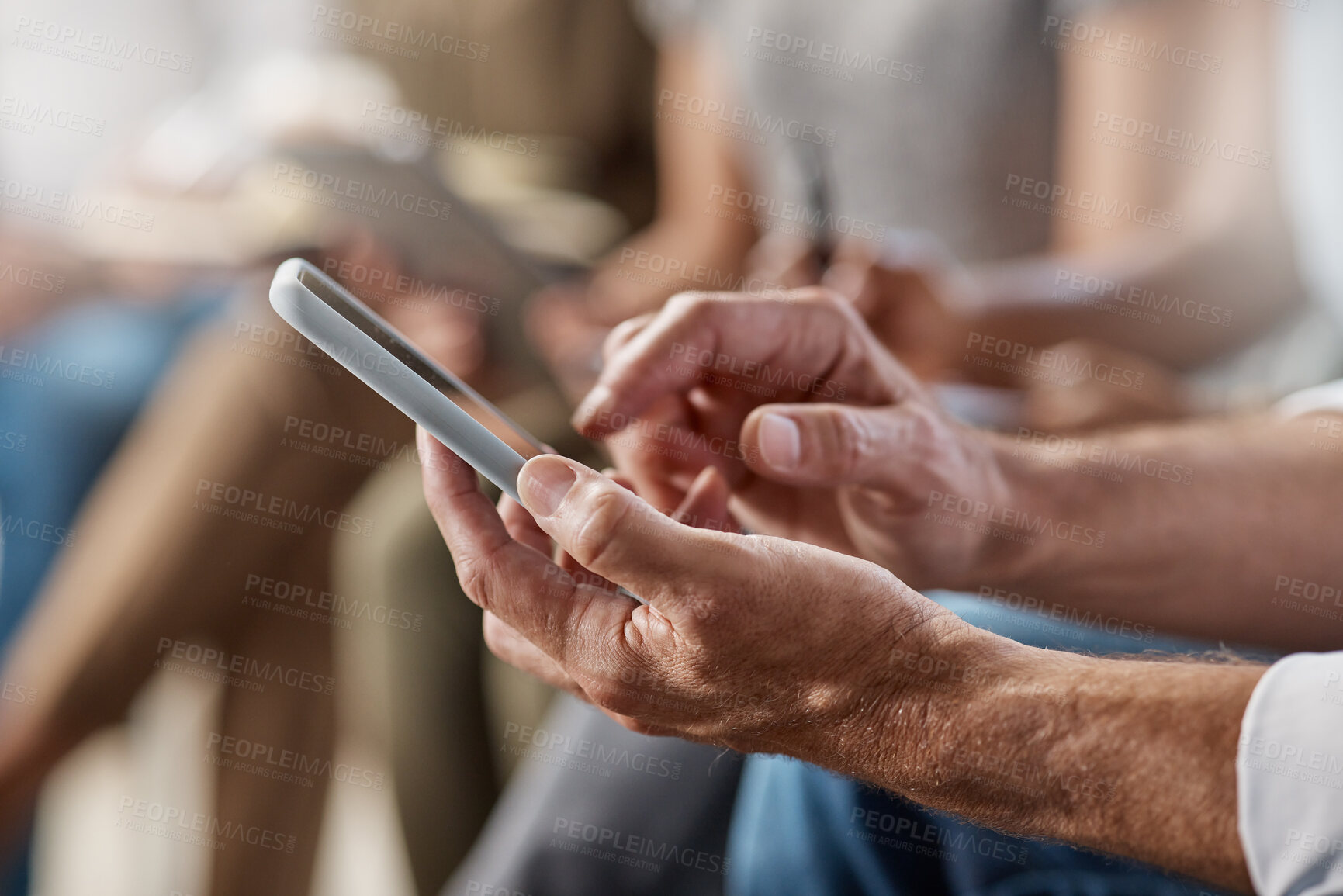 Buy stock photo Shot of an unrecognizable businessperson using a phone at work