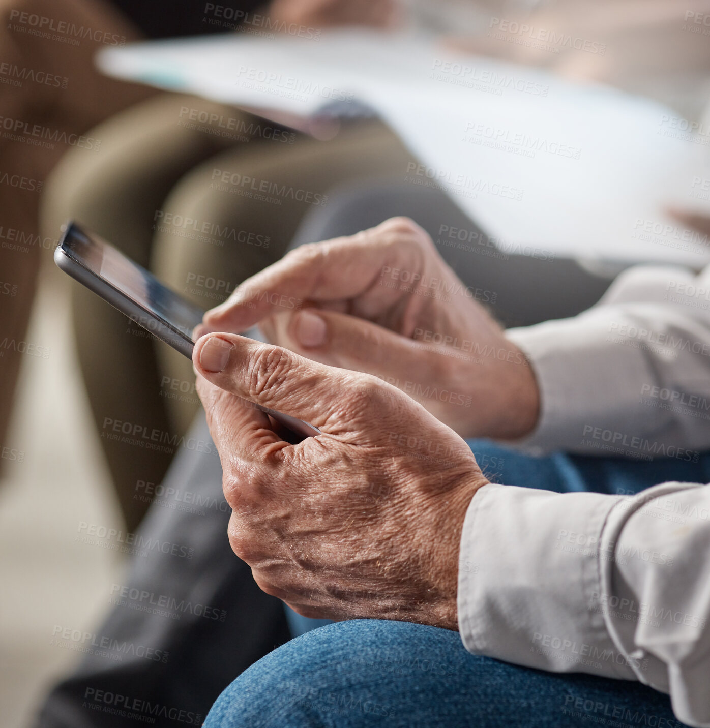 Buy stock photo Shot of an unrecognizable businessperson using a phone at work