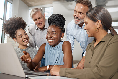 Buy stock photo Shot of a group of businesspeople using a laptop at work