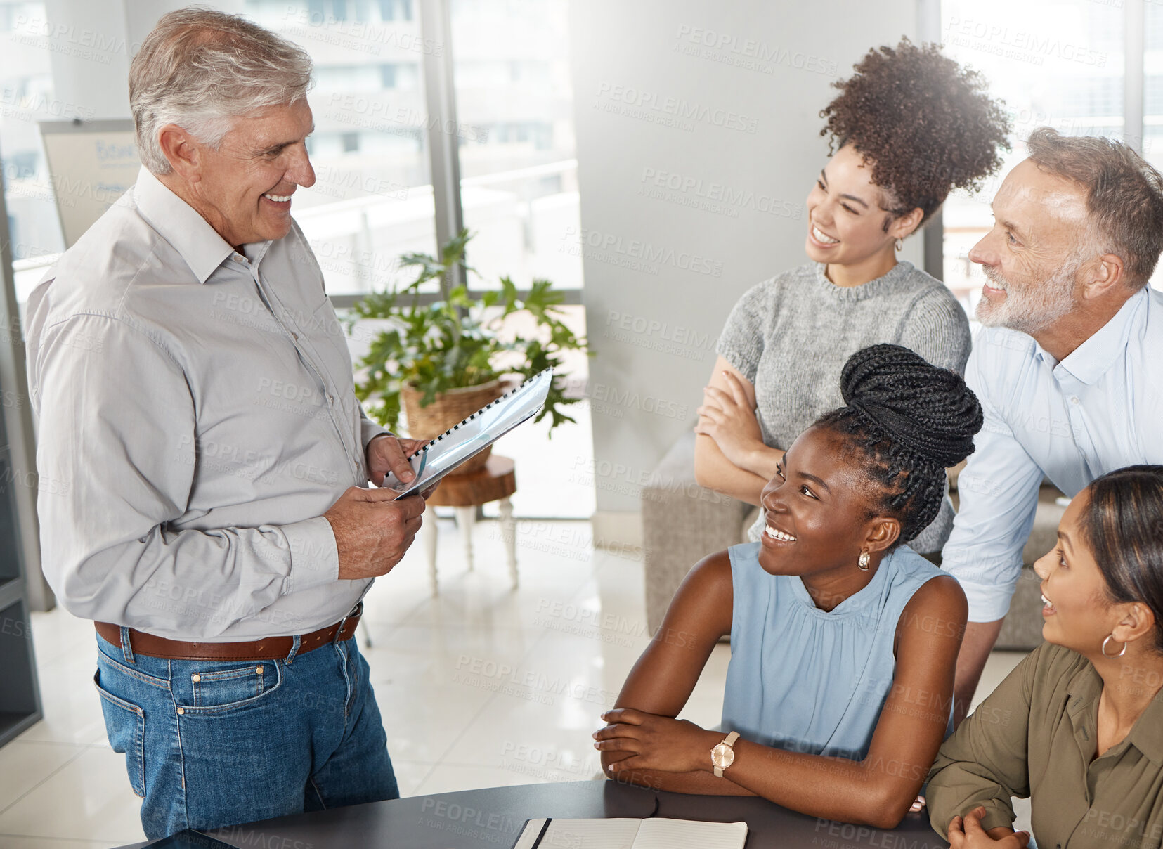 Buy stock photo Shot of a group of businesspeople in a meeting at work