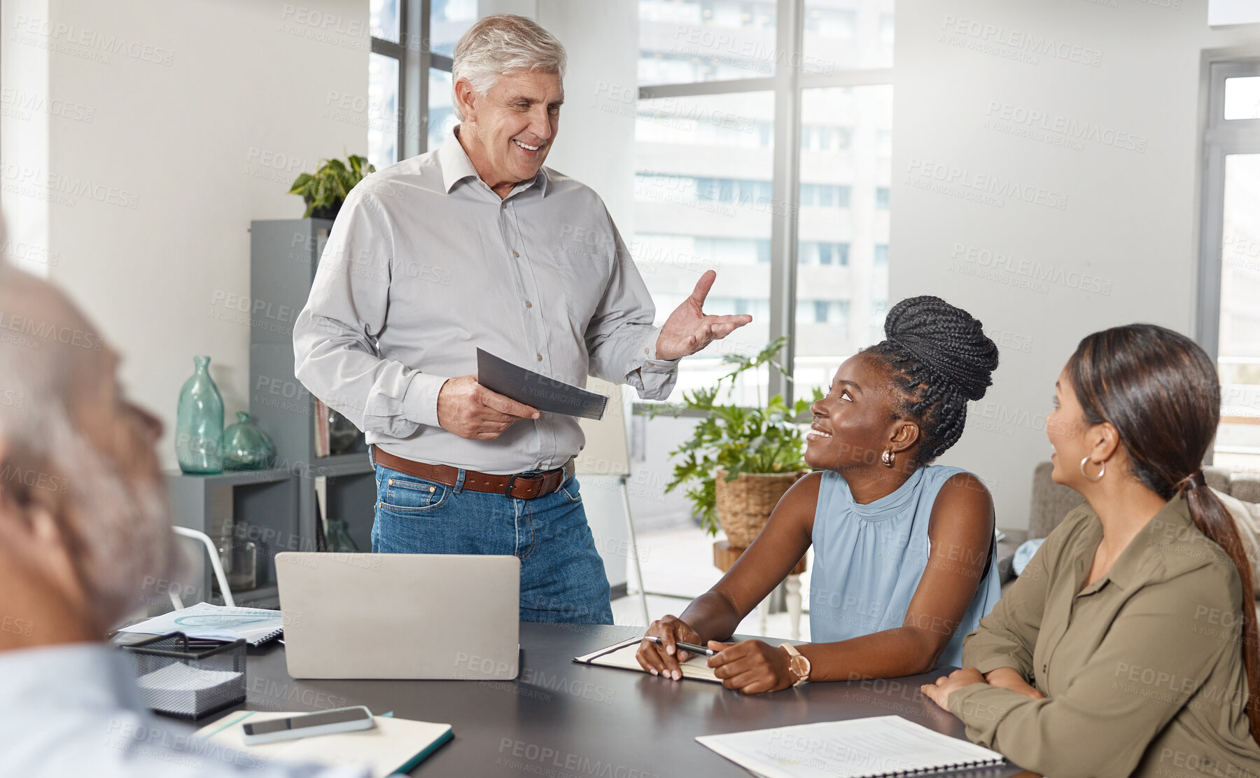 Buy stock photo Shot of a group of businesspeople in a meeting at work