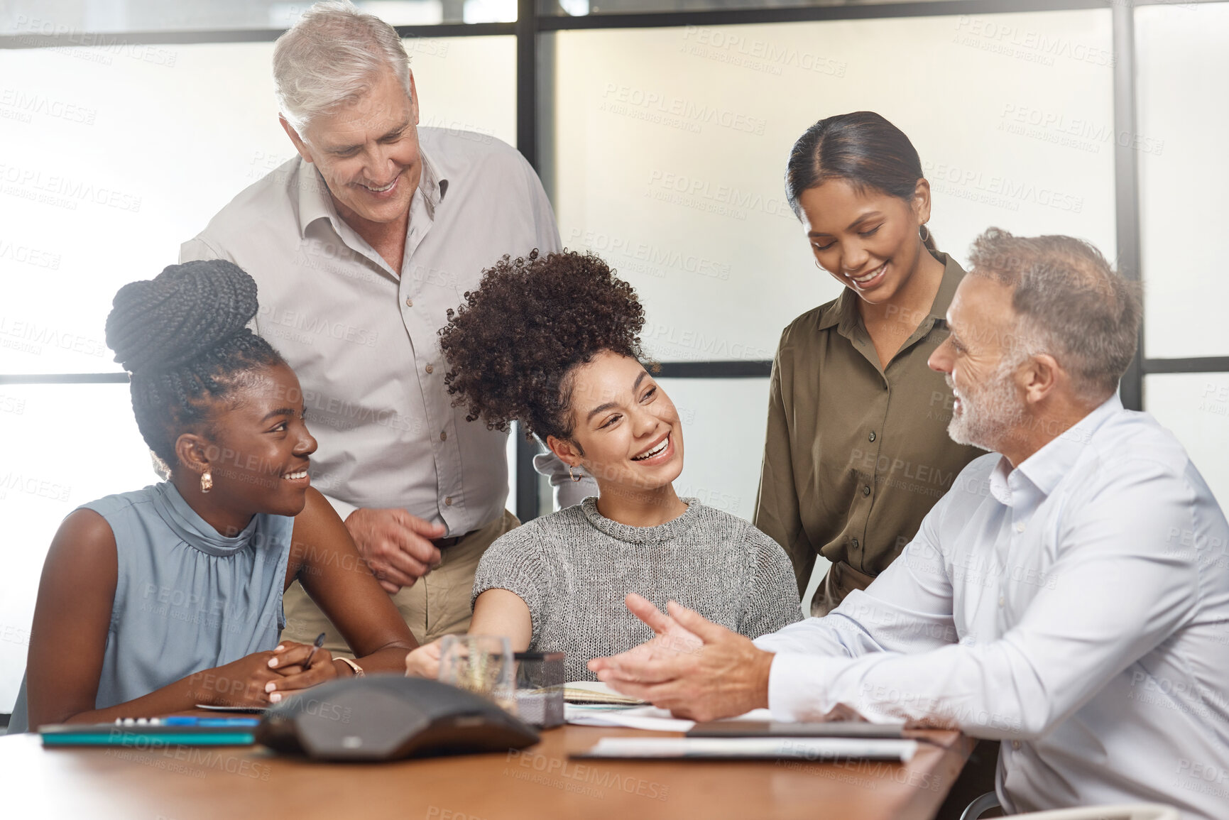 Buy stock photo Shot of a group of businesspeople in a meeting at work