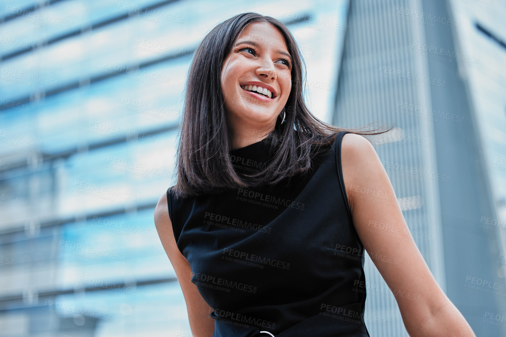 Buy stock photo Cropped shot of an attractive young businesswoman looking thoughtful while standing outside on the office balcony