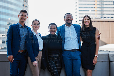 Buy stock photo Cropped portrait of a diverse group of businesspeople standing together outside on their office balcony