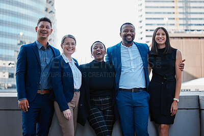 Buy stock photo Cropped portrait of a diverse group of businesspeople standing together outside on their office balcony