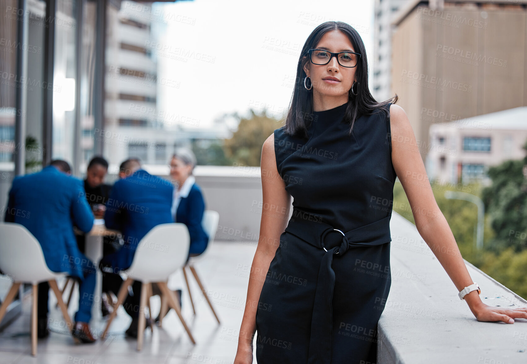 Buy stock photo Cropped portrait of an attractive young businesswoman standing outside on the office balcony