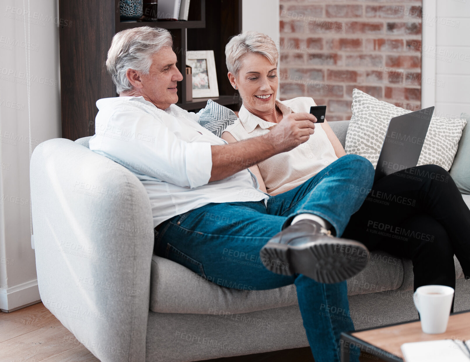 Buy stock photo Mature couple, laptop and credit card on couch with payment for bills, ecommerce and website for shopping. Sofa, senior man and woman with computer for online banking together and retirement budget