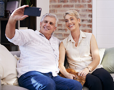 Buy stock photo Mature couple, phone and selfie on couch for social media update, profile picture and memory together. Mobile, senior man and woman on sofa for online digital gallery and video call or photograph