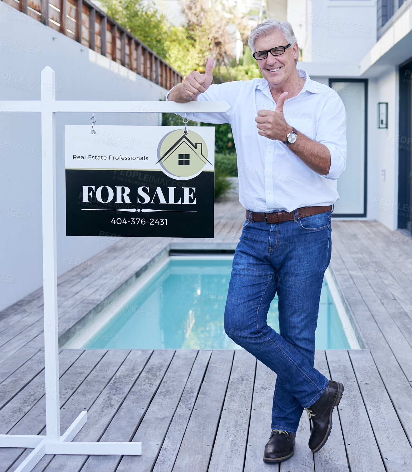 Buy stock photo Full length portrait of a handsome mature male real estate agent giving thumbs up while leaning on a for a sale sign