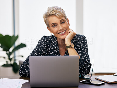 Buy stock photo Portrait, laptop and mature woman at desk in home office for article, copywriting or remote work in living room. Happiness, journalist and person with smile for web report, documents and freelancer