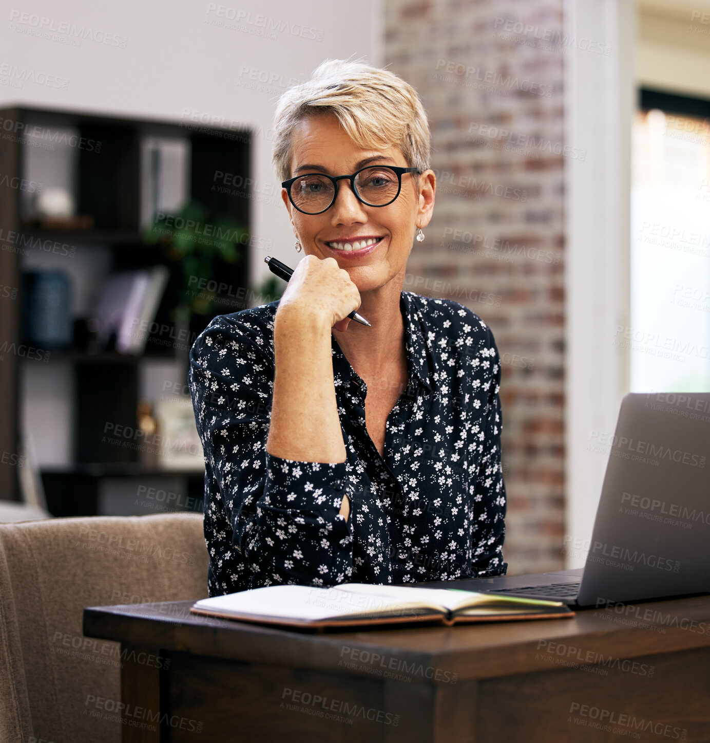 Buy stock photo Portrait, laptop and mature woman in home office with notebook at desk for article, post update or remote work in living room. Happiness, journalist and person for web report, news or freelancer