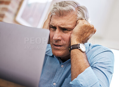 Buy stock photo Laptop, mature businessman and anxiety from burnout with stress in home office, overworked and tired at desk. Technology, male freelancer and unhappy for job, mental health and deadline in workplace