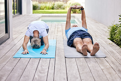 Buy stock photo Shot of a mature couple exercising together outdoors