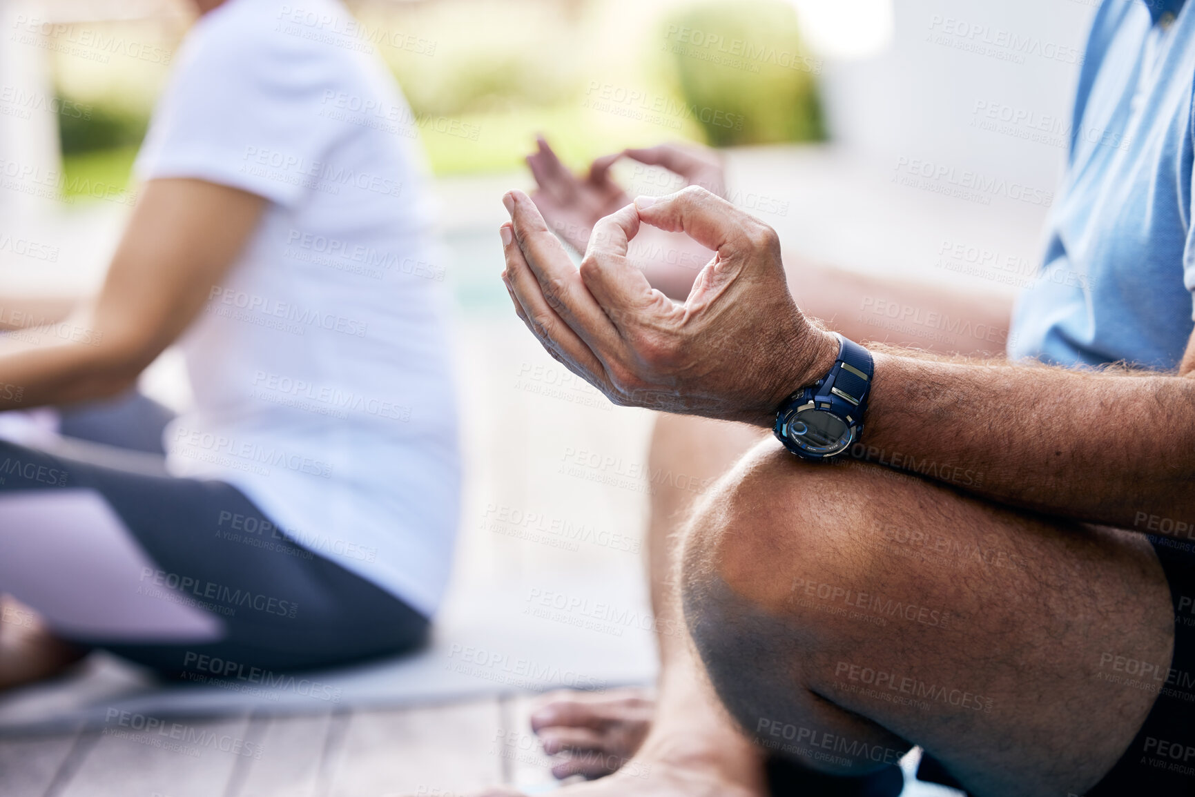 Buy stock photo Closeup shot of an unrecognisable couple meditating outdoors