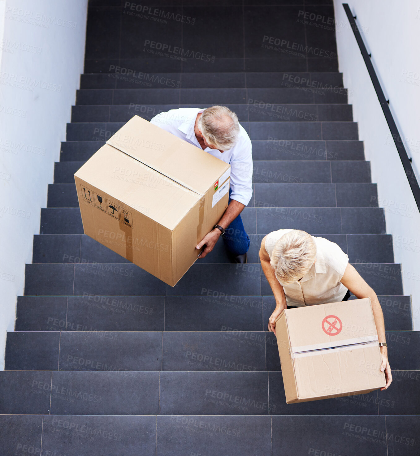 Buy stock photo Mature people, moving and boxes in stairs, new house and property for real estate, busy and unpacking. Mortgage, man and partner in marriage, homeowner and purchase of apartment with loan or together