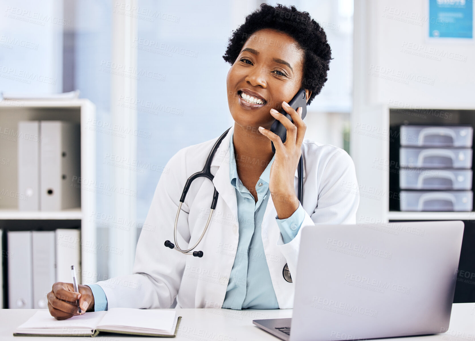 Buy stock photo Laptop, phone call and portrait of doctor black woman at desk in hospital for appointment. Computer, schedule and writing in notebook with professional advice in clinic for healthcare or medicine