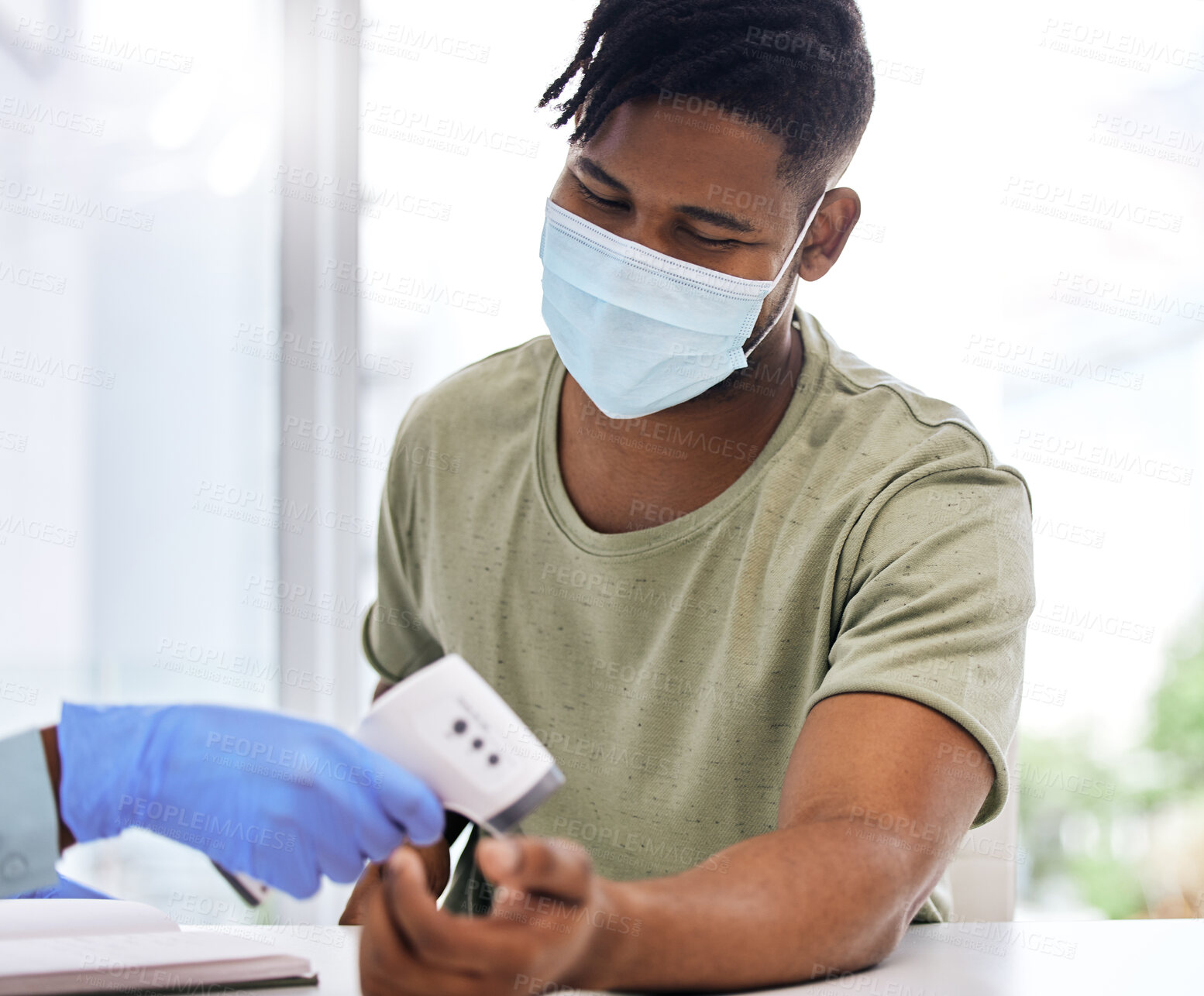 Buy stock photo Black man, face mask and doctor with thermometer for healthcare checkup in hospital clinic or medical center. Hand, infrared temperature test or nurse screening for fever, virus or disease on patient