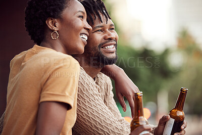 Buy stock photo Shot of an affectionate your couple drinking beer while bonding on a balcony outdoors