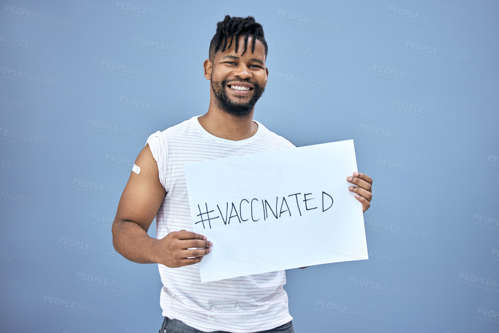 Buy stock photo Sign, vaccinated and portrait of man in studio with placard for healthcare injection for flu. Vaccine, smile and African person with poster, paper or board for medical immunization by gray background