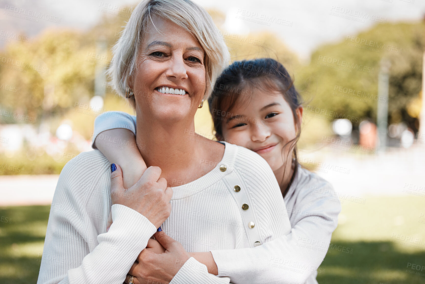 Buy stock photo Girl, grandmother and portrait with happiness in the outdoor on the weekend in nature. Kid, grandma and hug in summer with smile on face for love and family in the garden with pride, care and bond.