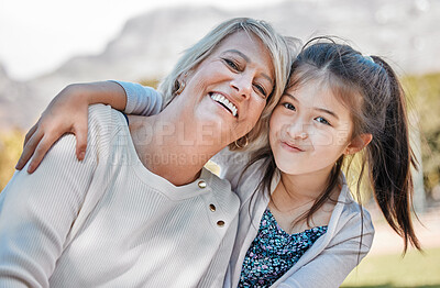 Buy stock photo Grandmother, girl and portrait with happiness outdoor and hug for happy family at the park. Female child, woman and face of grandma with love, joy and smile in garden with kids, care or bond together