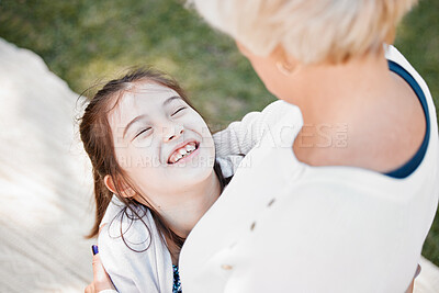 Buy stock photo Young girl, happy and hug grandmother in nature for love, affection and excited outdoors. Child, grandma and squeeze for care, compassion and support in park for bonding, relationship and picnic