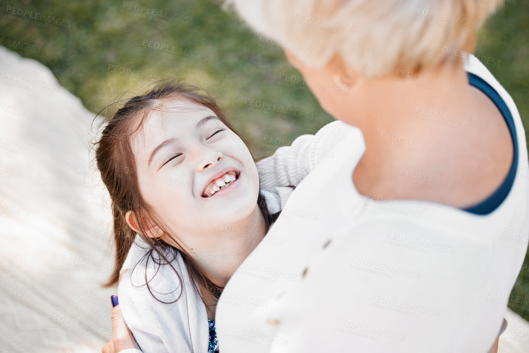 Buy stock photo Young girl, happy and hug grandmother in nature for love, affection and excited outdoors. Child, grandma and squeeze for care, compassion and support in park for bonding, relationship and picnic