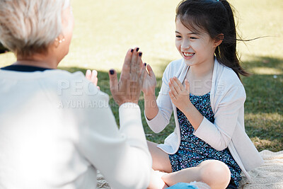 Buy stock photo Grandma, girl and smile in park for playing game for bonding, support and care on child development. People, trust and happy in outdoor for memories, fun and growth as family on holiday in London