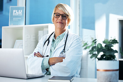 Buy stock photo Shot of a female doctor sitting in her office