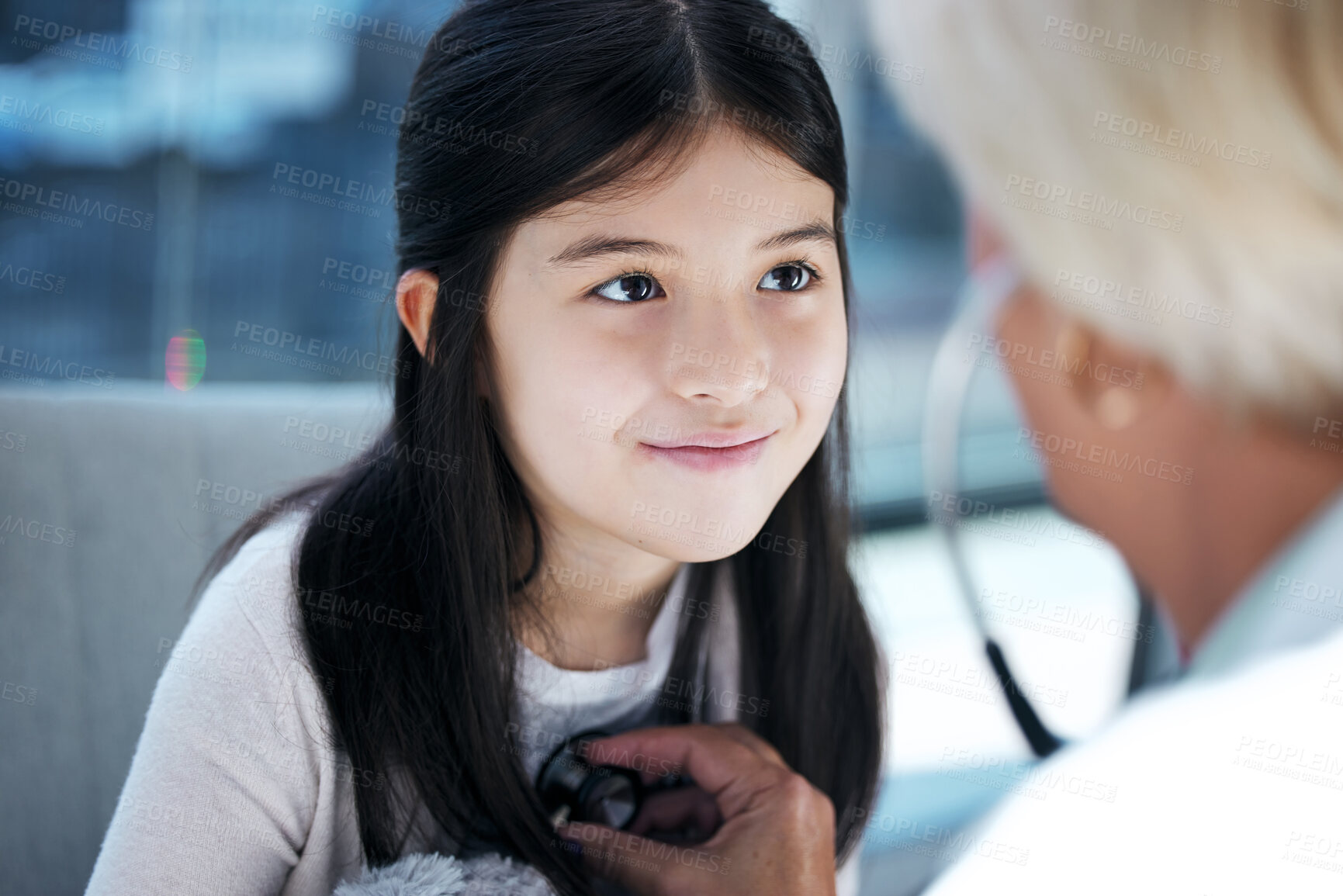 Buy stock photo Shot of a little girl getting a checkup at the clinic